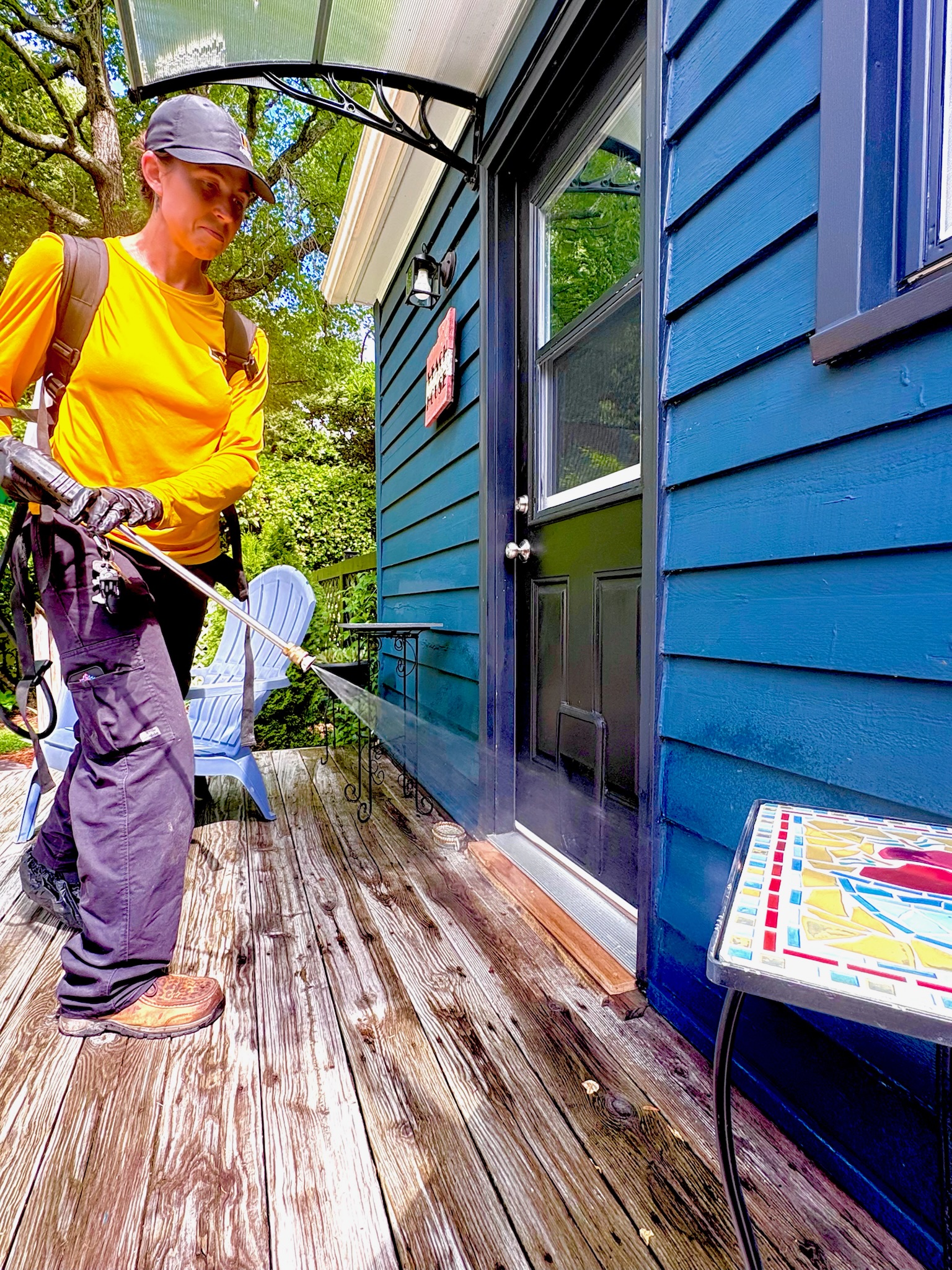 A pest control specialist from Accel applies an airborne pest deterrent.